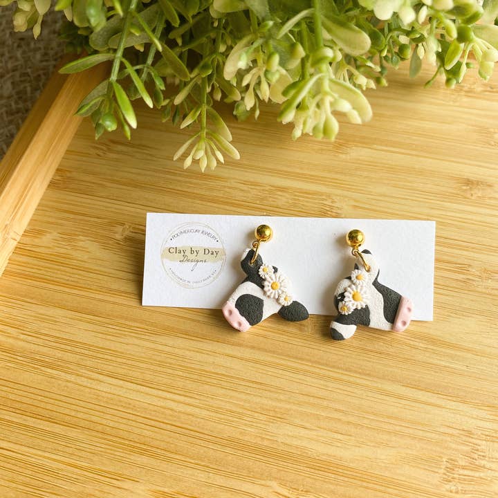 Clay by Day Designs - Wholesale Dangle Earrings - Floral Crown Cow. Country western - polymer clay earringÂ