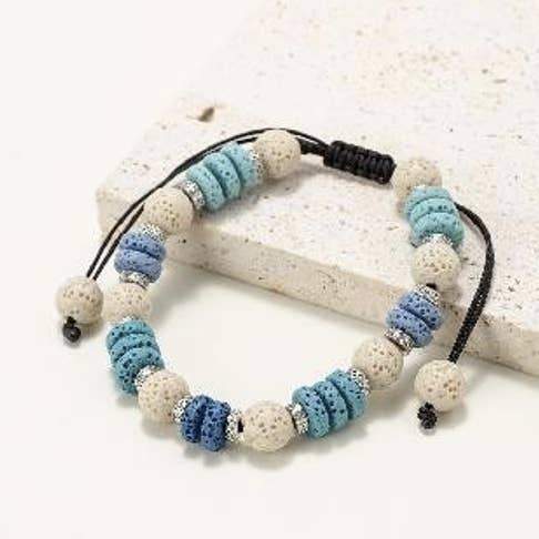 Bracelets made of round and flat beads in natural lava stone for wholesale by INNOBIZ