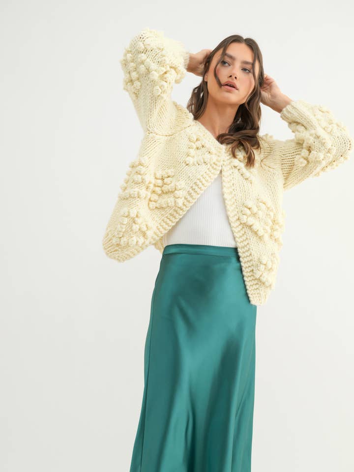 CREAM HAND-KNIT POM-POM HEART CARDIGAN / WL24-9723 for wholesale on Faire