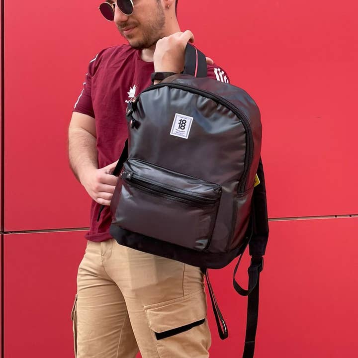 Black University backpack with vinyl front for wholesale on Faire2