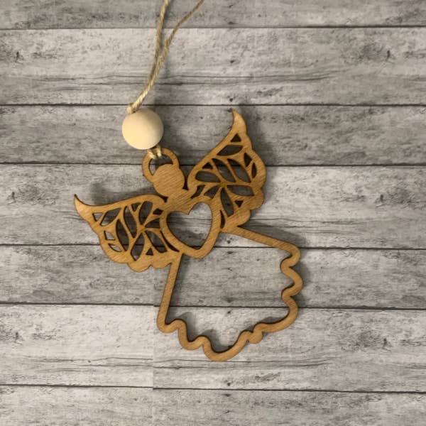 A Devine Messenger Angel Ornament for wholesale by Plums & Roses