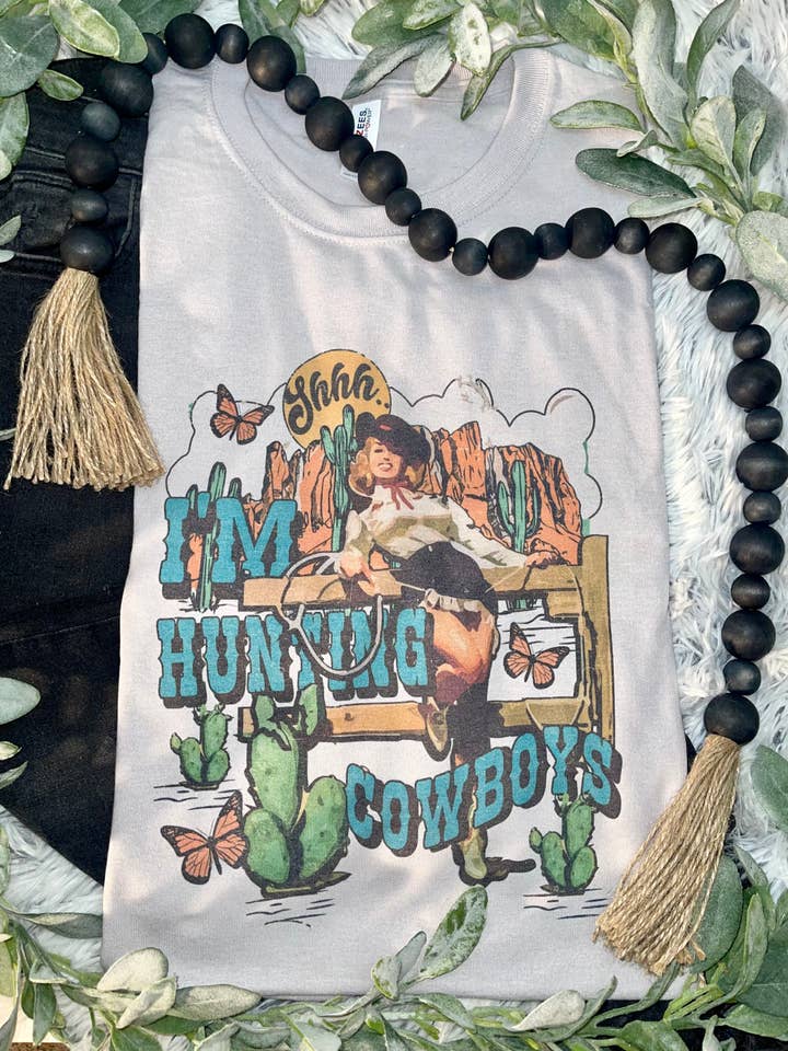 Silver I'm Hunting Cowboys (T-Shirt) for wholesale on Faire