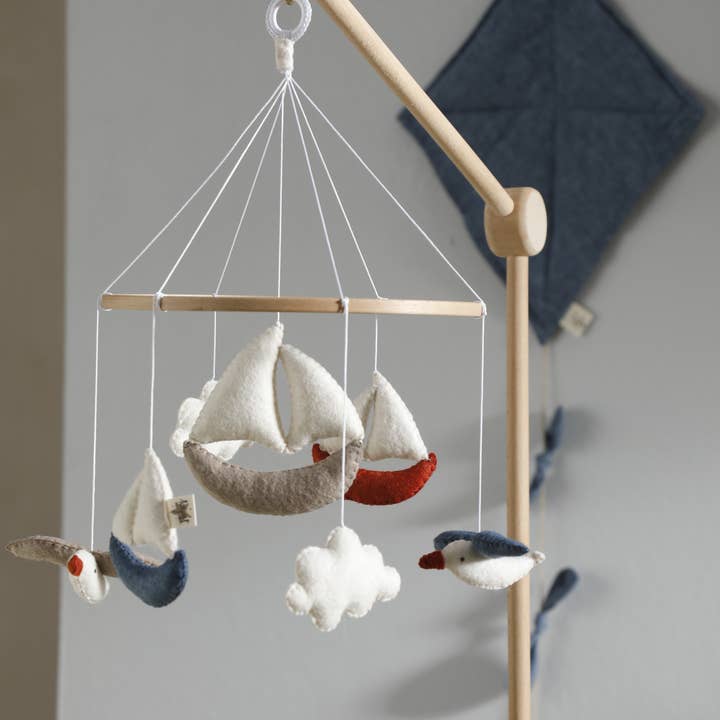 MARINA baby mobile, coast, seagull, sea, boat, handmade and other Purchase Wholesale felt rolls. Free Returns & Net 60 Terms on Faire trending on Faire.