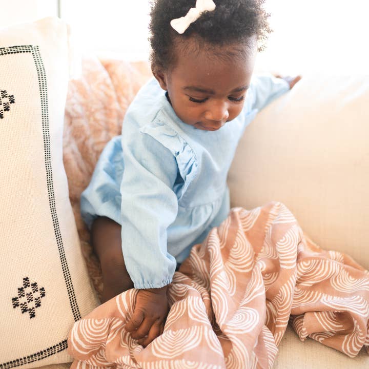 Swaddle // Labadi Beach Sunset for wholesale by The Rooted Baby Co.