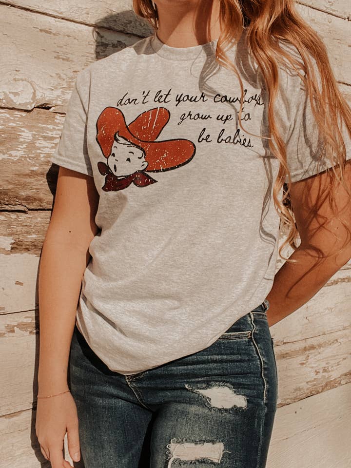 Don't let your cowboys grow up to be babies Western Graphic for wholesale by Rustic Runaway LLC