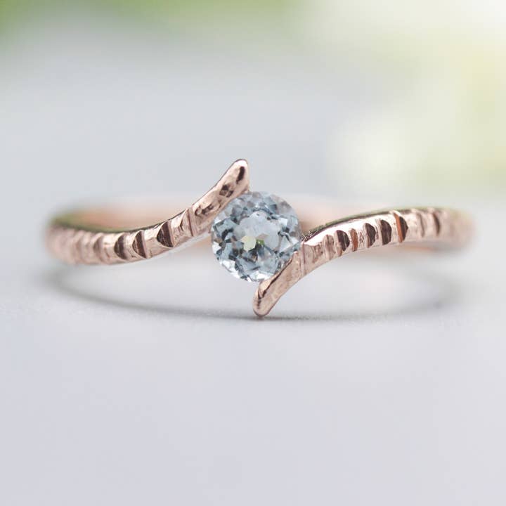 14k Rose Gold Bypass Ring with Round Blue Topaz for wholesale by Metal Studio Jewelry