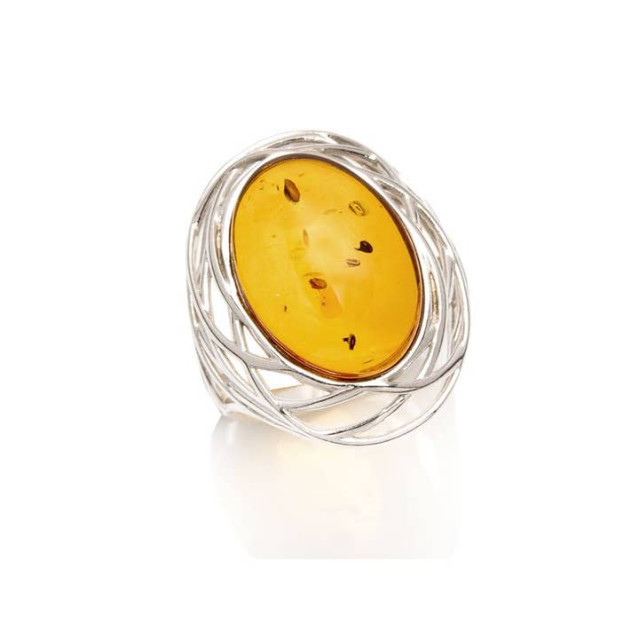 Anello grande con pietra ovale di ambra naturale cognac, argento sterling 925 rodiato per la vendita all'ingrosso da parte di OPALOOK France
