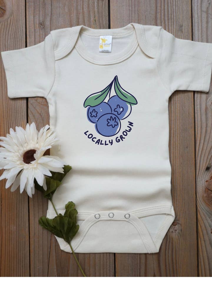 'Locally Grown' blueberry baby bodysuit, fruit baby outfit for wholesale by Sunshine Collective