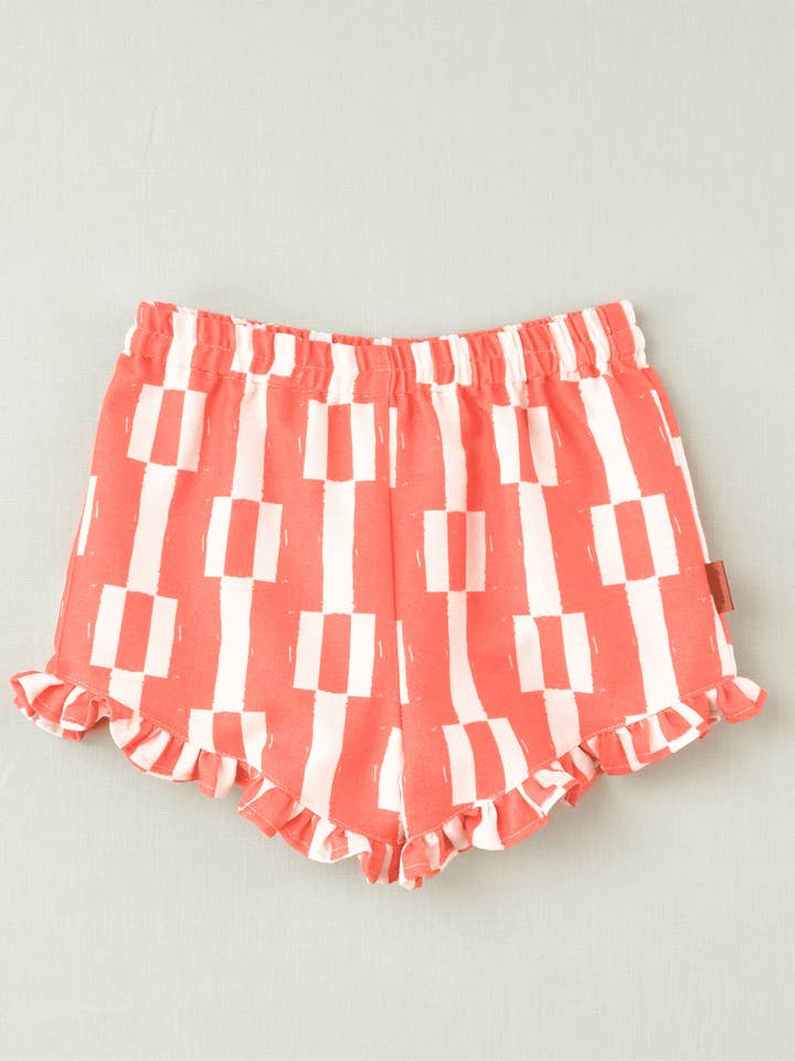 Calções curtos geométricos vermelhos para menina por atacado de Charanga