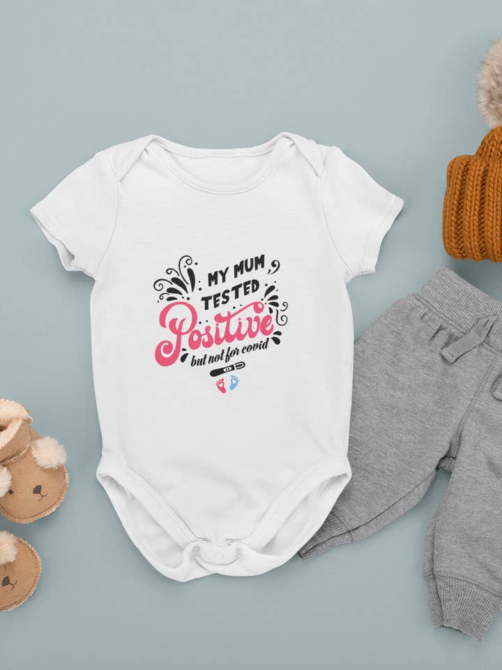 My Mum Tested Positive But Not For Covid Baby Bodysuit Pink Short Sleeved for wholesale by Little Ratbag