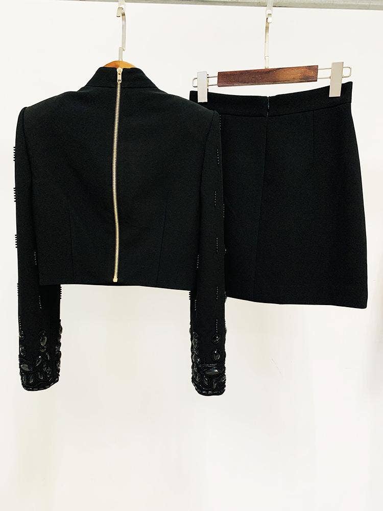 Preto Conjunto de duas peças Emery com blusa de manga longa e saia, decorado com cristais pretos para venda a revendedores na Faire2
