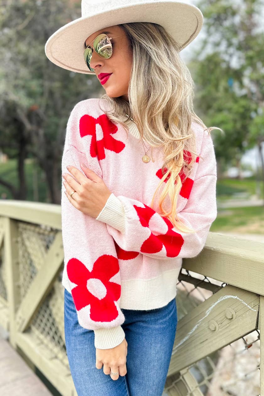 Rouge Pull douillet en tricot imprimé de marguerites rouges en vente sur Faire3