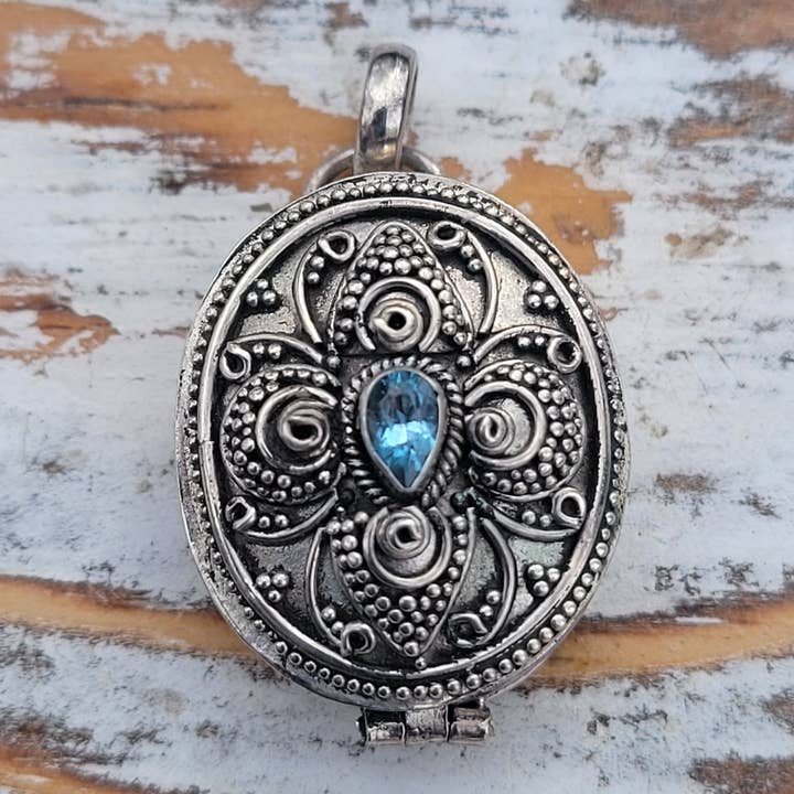 Silver Insanity – wholesale Individual charm/pendant – Oval Blue Topaz Sterling Silver Poison Box Locket Pendant