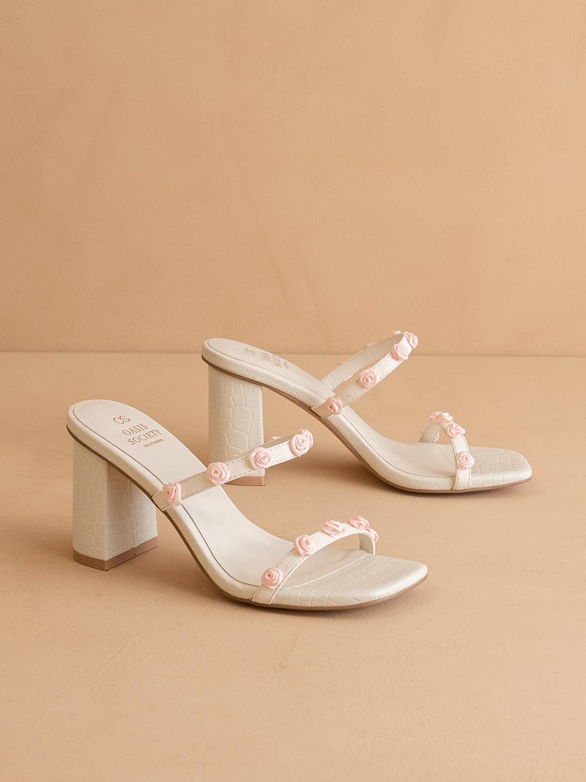 The Nia White | Rosette Adorned Heel for wholesale on Faire1