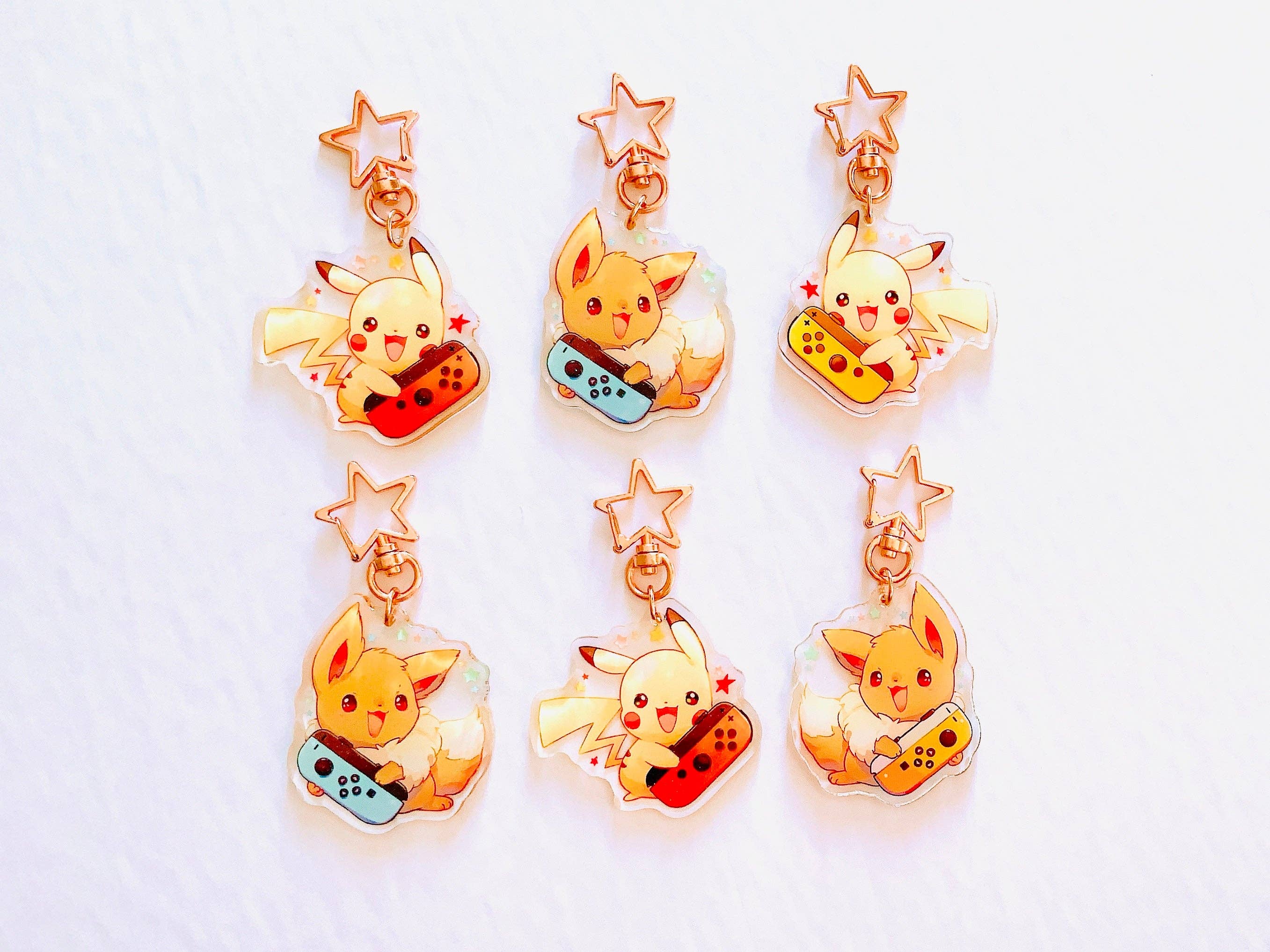 ToasterKiwi - Wholesale Keychain - Unisex - Pikachu Eevee Nintendo Switch Charms (2.5 inch Clear Acrylic)1