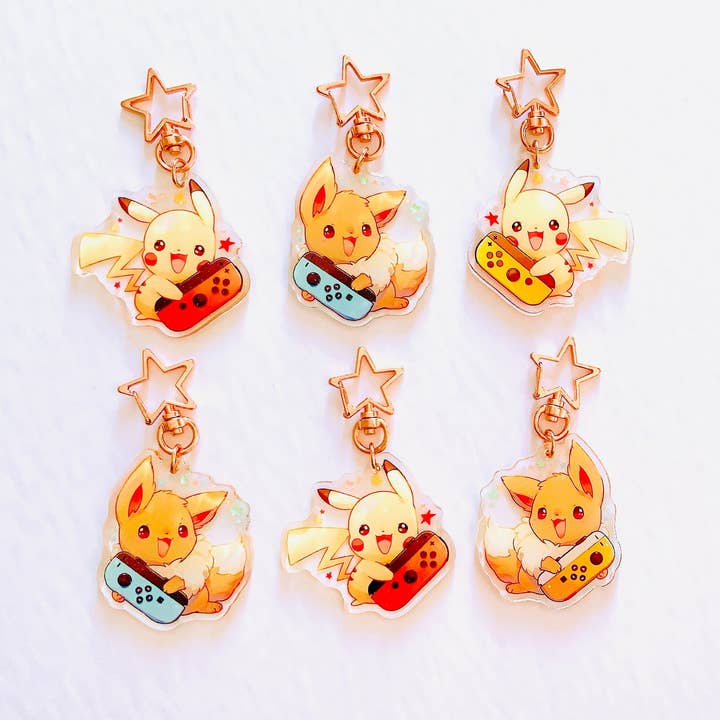 ToasterKiwi - Wholesale Keychain - Unisex - Pikachu Eevee Nintendo Switch Charms (2.5 inch Clear Acrylic)1