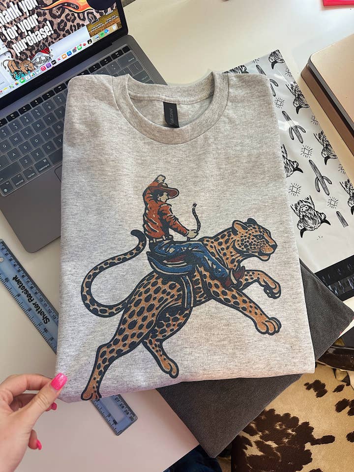 Gunpowder and Glam Boutique - Wholesale Graphic Sweatshirt - Women's - Cowboy Jaguar Tee or Crewneck1