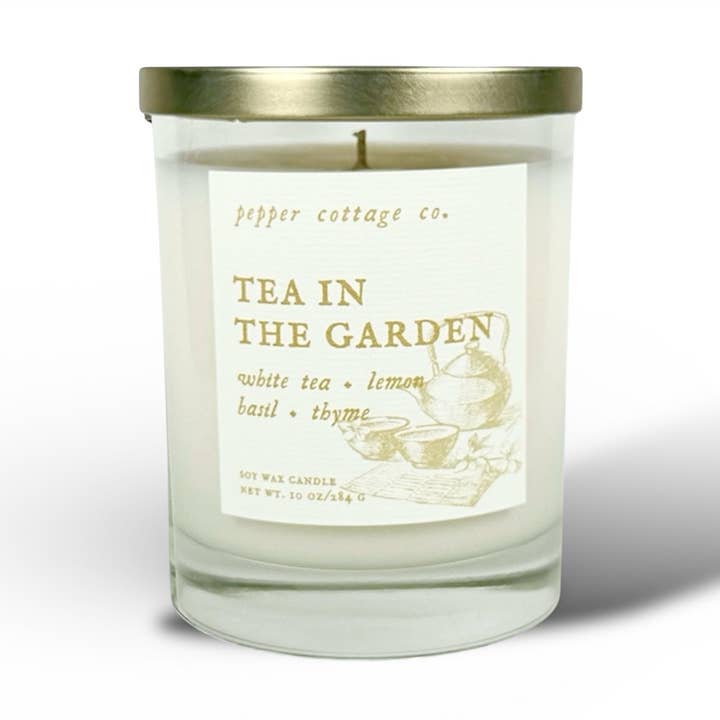 Tea in the Garden 10 oz Soy Candle Jar | White Tea, Lemon, Basil, Thyme | Clean, Herbal, Calming Scented Candle for wholesale by Pepper Cottage Co. Candles
