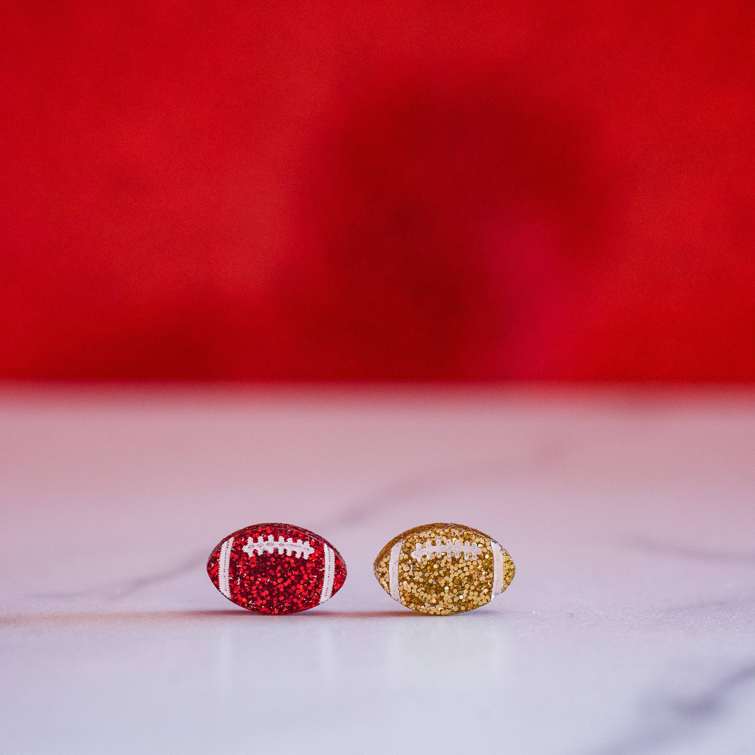 Stellar Gifts & Goods Wholesale - Wholesale Stud/Post Earrings - KC Football - Glitter Hand Painted Football Studs Red & Gold1
