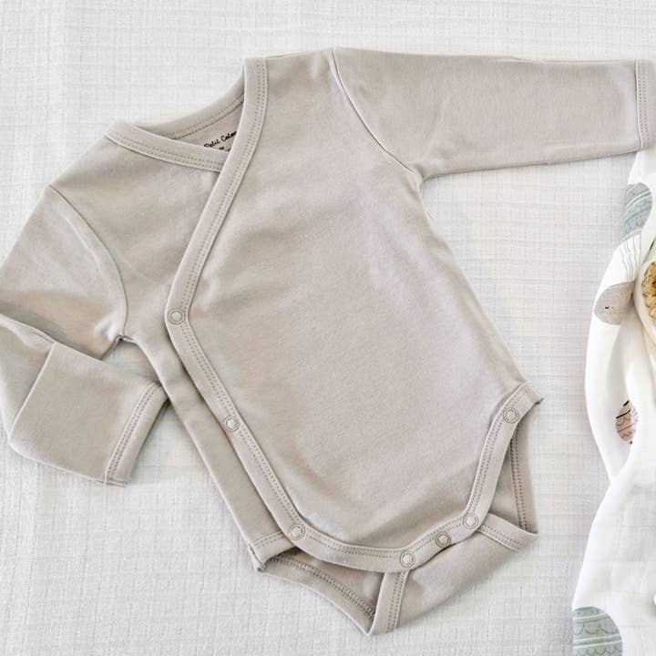 MILO baby wrap-over bodysuit 100% organic cotton and other Purchase Wholesale milsani. Free Returns & Net 60 Terms on Faire trending on Faire.