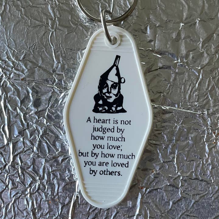 Motel Key Fob - Tin Man (Oz) - Quote (A heart is not...) for wholesale by The 3 Sisters Design Co.