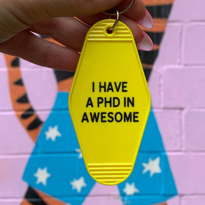 GetBullish - Vente Porte-clés – femme - J'ai un doctorat en génial Yellow Motel Style Keychain0