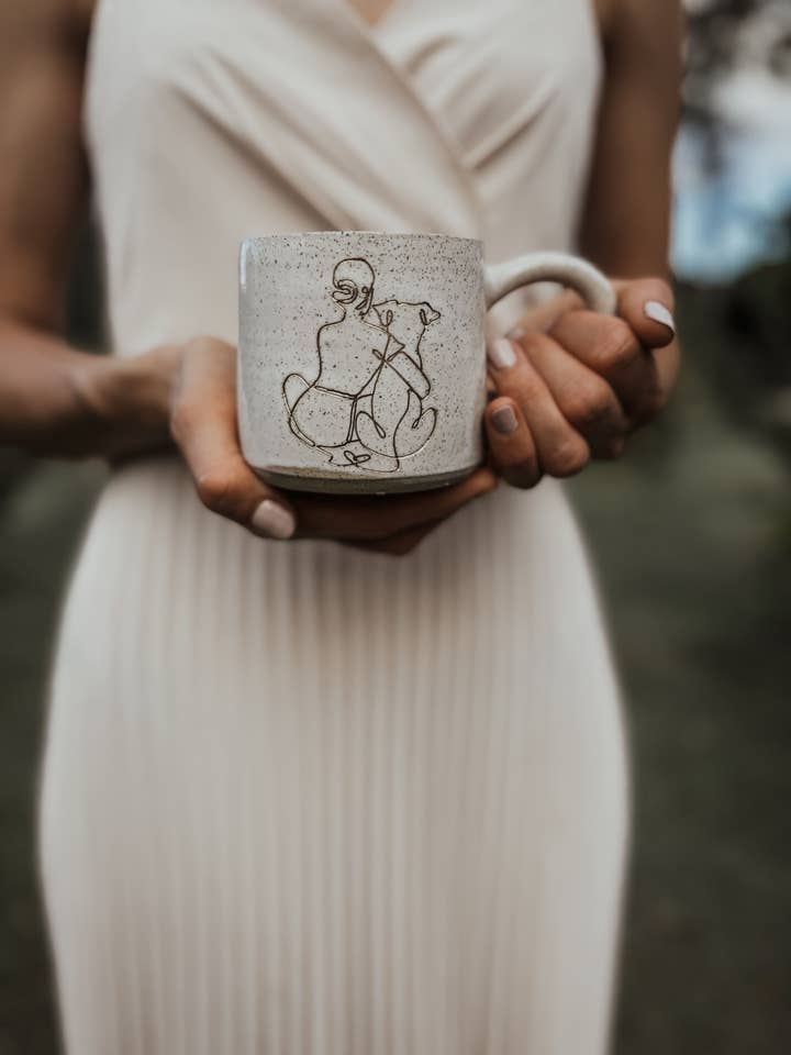 Ceramic mug - Girl hugging dog for wholesale by Wolf and Clay Pty Ltd