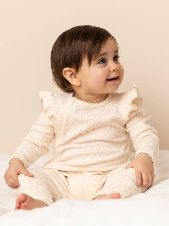 Gerüschter Apfel-Strampler für den Großhandel von RAI & CO