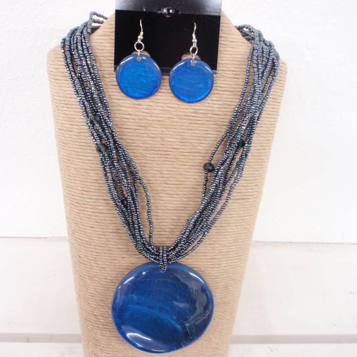 8 STRANDS BLUE SEED BEADS WITH ROUND RESIN WITH CAPIZ PENDAN for wholesale by International Duru's