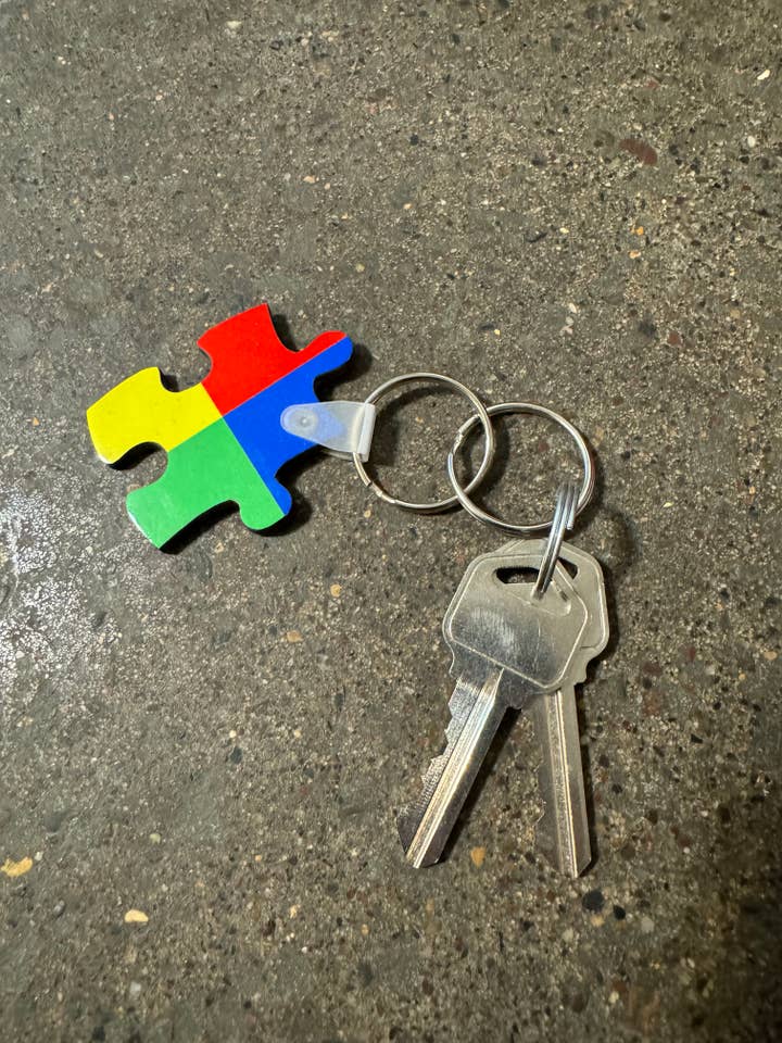 Colorful autism puzzle piece keychain for wholesale by Squatchin’ Country