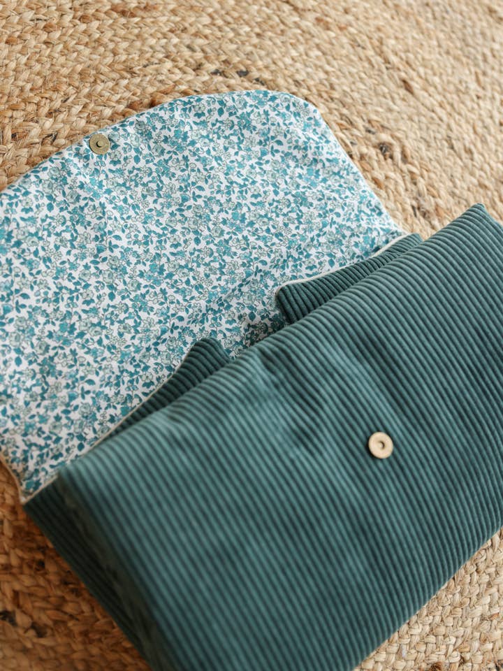 Portable changing mat in fir green velvet for wholesale by Banane and co