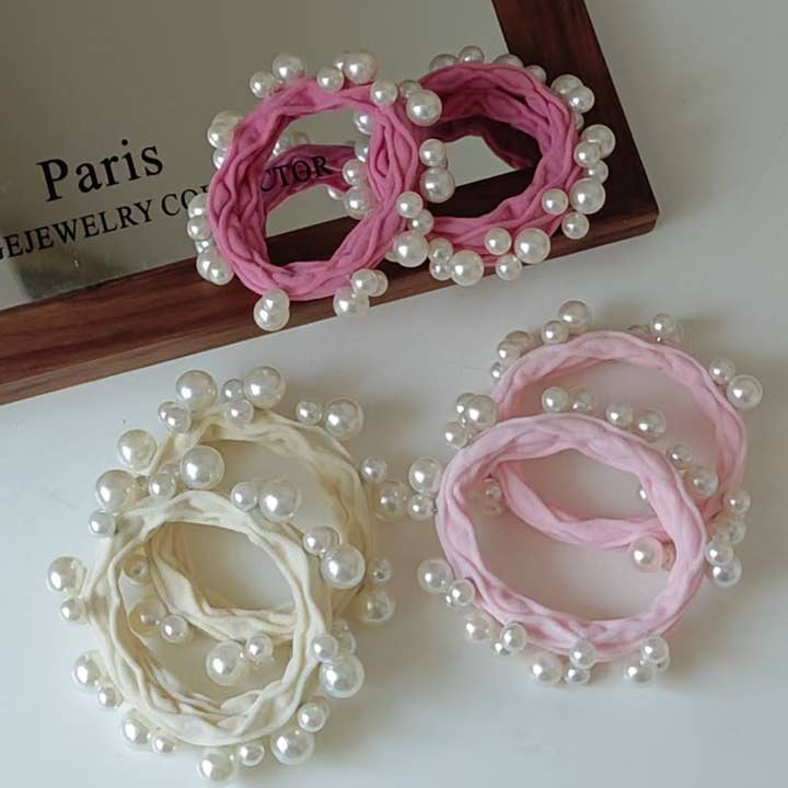 Assorted Pink Textured Seamless Pearl Hair Ties (Set of 6) for wholesale on Faire2