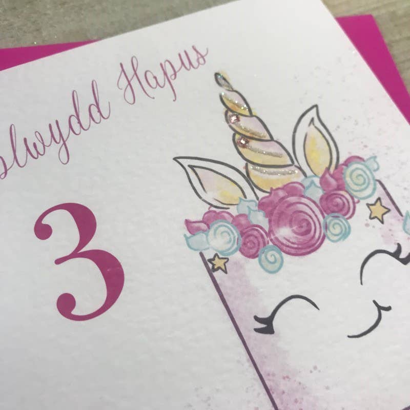 White Cotton Cards - Wholesale Birthday Card - Welsh Age 3 - Unicorn Cake (W-R101-3)1