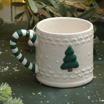 Mug en céramique embossé de Noël avec anse rayée pour la vente par Langs