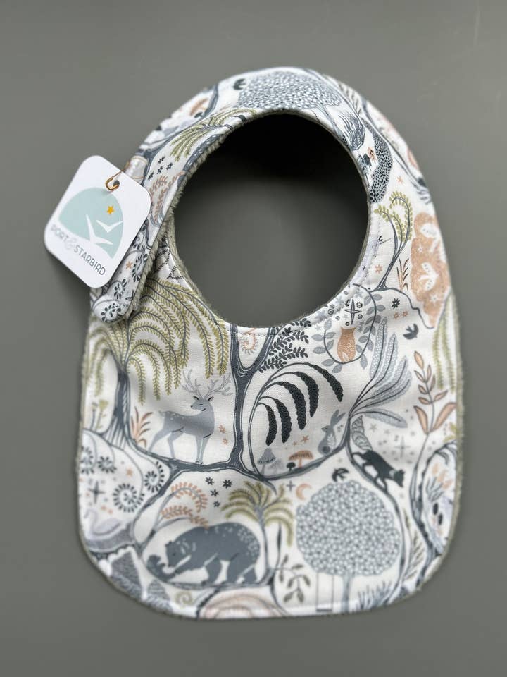 Into the Mystical Forest bib for wholesale by Port & Starbird