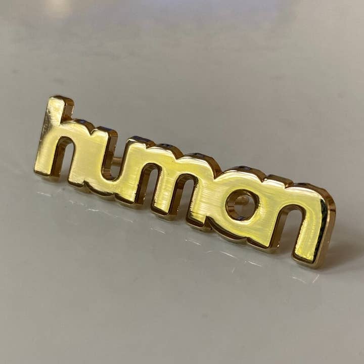 "I Am Human" Gold Pin for wholesale by Civic Saint