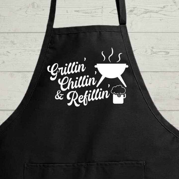 Funny Men's Apron - Grillin' Chillin' and Refillin' - Hilarious BBQ Apron" for wholesale by Rustic Charm Crafting Co.