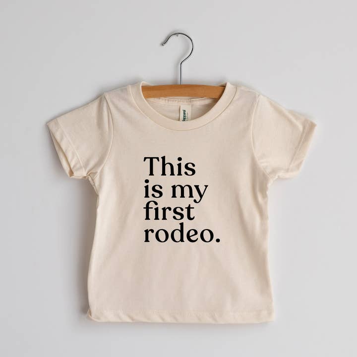 This Is My First Rodeo Cream Organic Baby Tee for wholesale by Gladfolk
