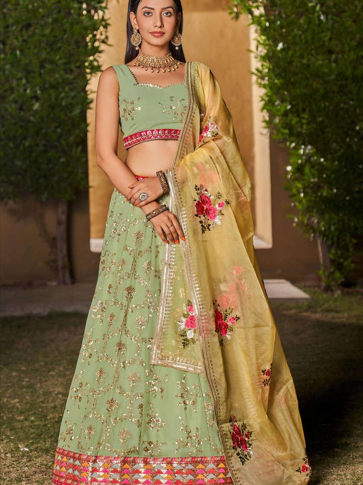 Pista grøn georgette lehenga choli til indiske og pakistanske bryllupsfestivaler - paillet- og trådbroderi, zari-arbejde, dori-arbejde, broderi, printarbejde for engroshandel hos HATKE BRIDE