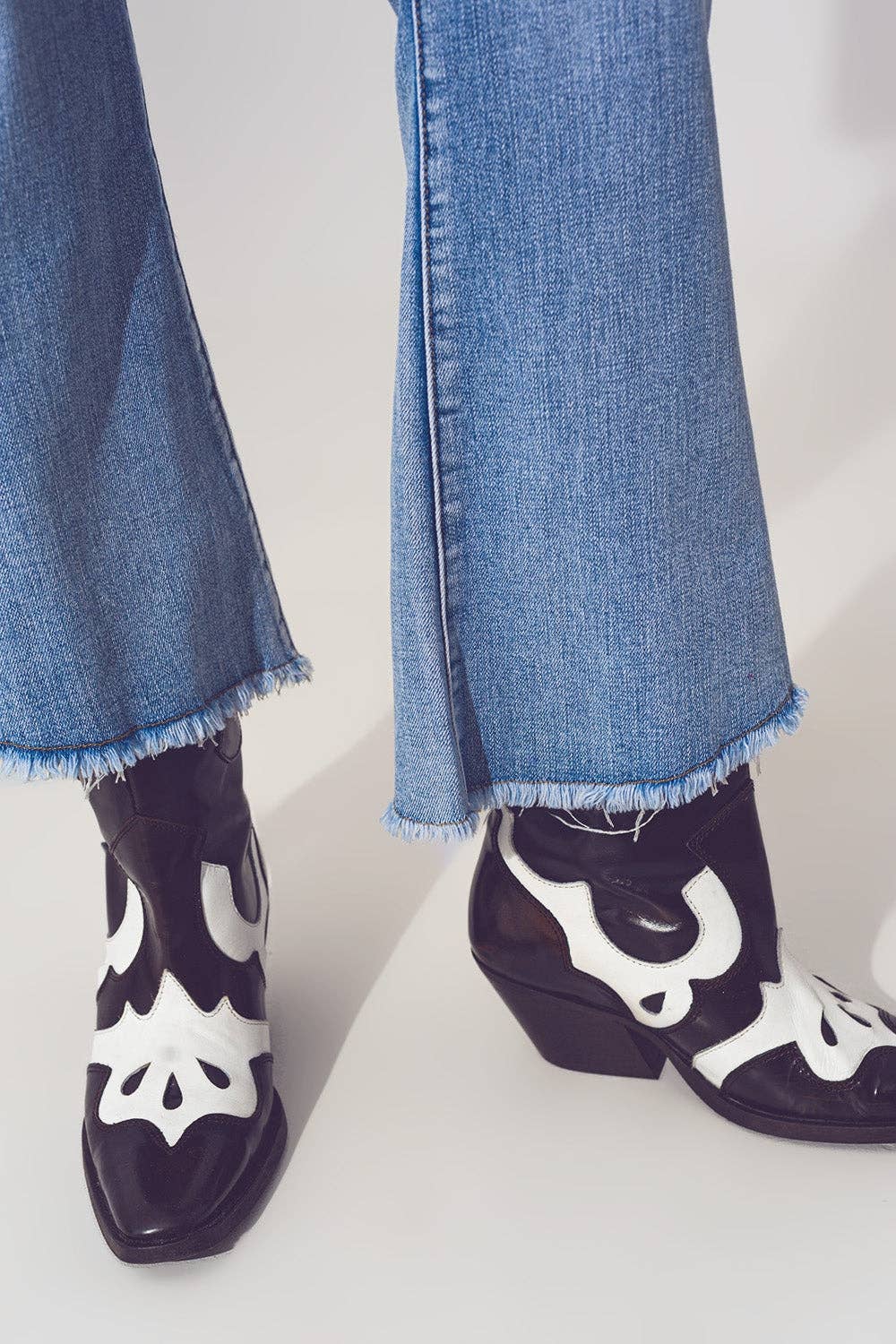 Flared Jeans in Light Blue with Asymmetric Hem for wholesale on Faire3