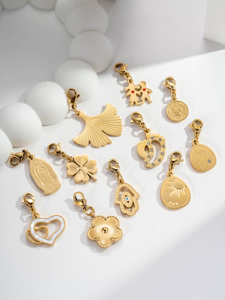 Set of 11 gold pendants Assorted Charms in stainless steel for wholesale by COSMOS