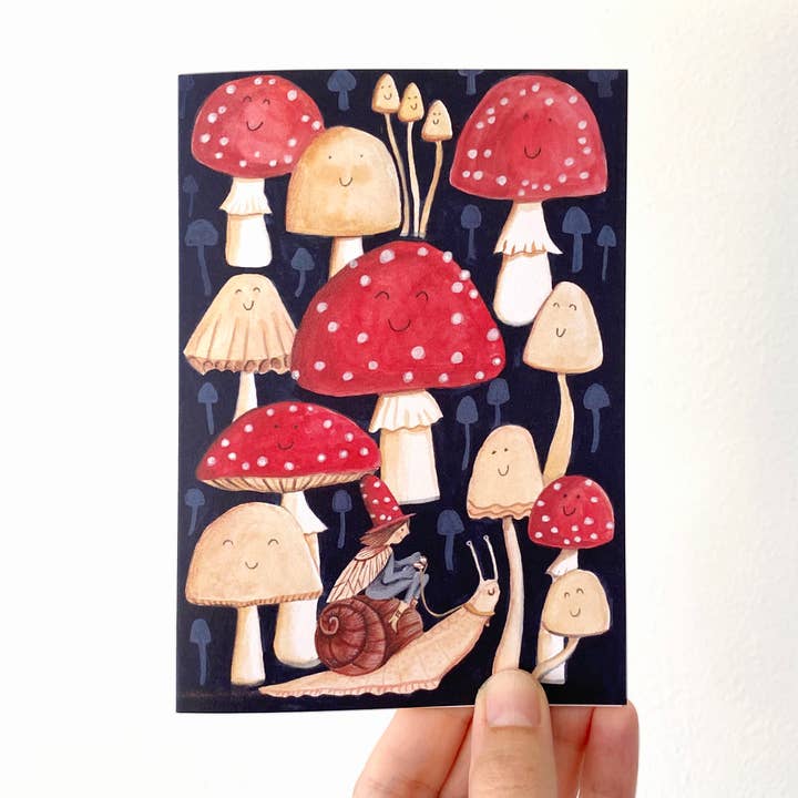 Elf riding a snail in a toadstool forest greetings card, A6 for wholesale by Juliet Thomas Doodles