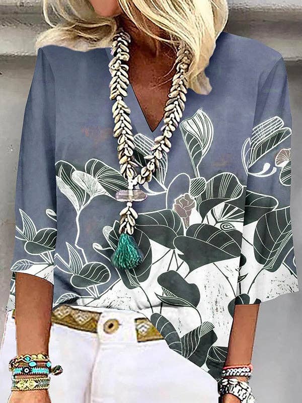 UZ Wholesale Store - Vendita all'ingrosso Camicetta - Donna - T-shirt larghe con scollo a V con stampa floreale e maniche a tre quarti1