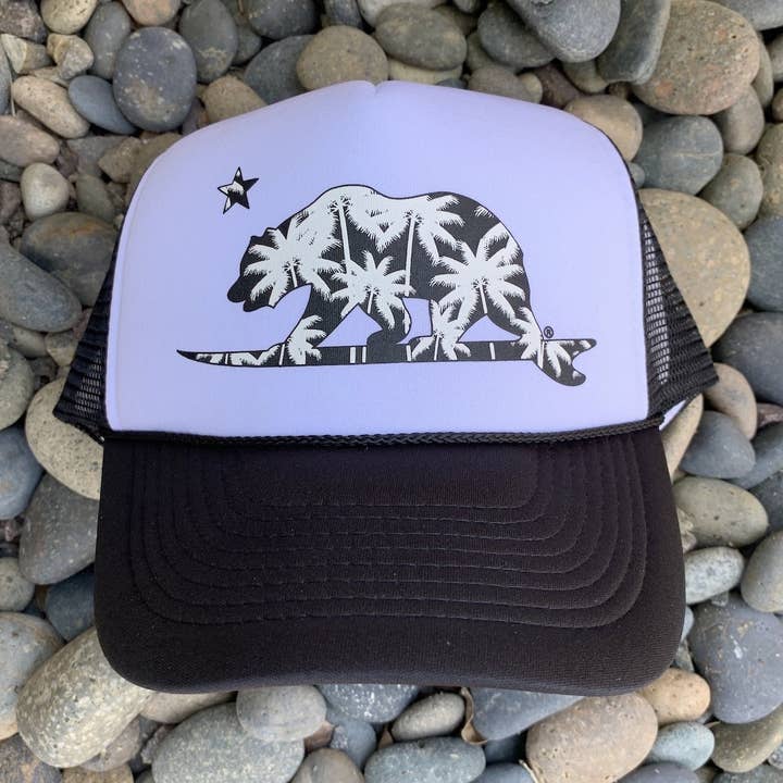 Palm Tree Surfing Bear Trucker Hat for wholesale by Pacific Coast Apparel