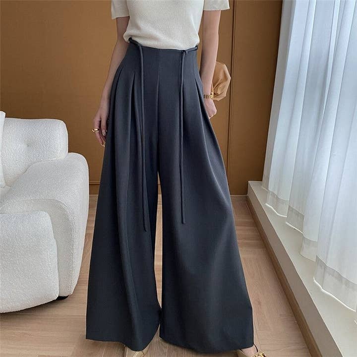 Sure! Here is an optimized title for your clothing product in English:
"Elegant High Waist Wide Leg Trouser Suit with Belt for wholesale by UZ Wholesale Store
