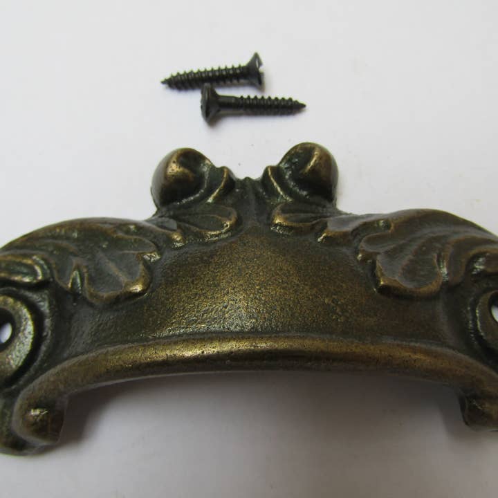 IronmongeryWorld - Wholesale Knob/Pull - Feathered Cup Pull Handle Antique Brass