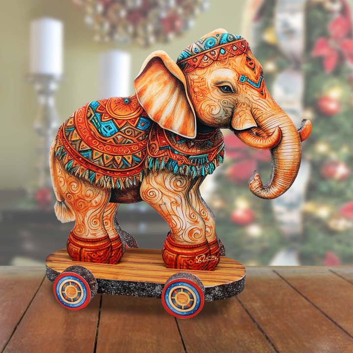 Encantadora figura coleccionable de elefante sobre ruedas Debrekht para venta al por mayor de G.DeBrekht Artistic Studios