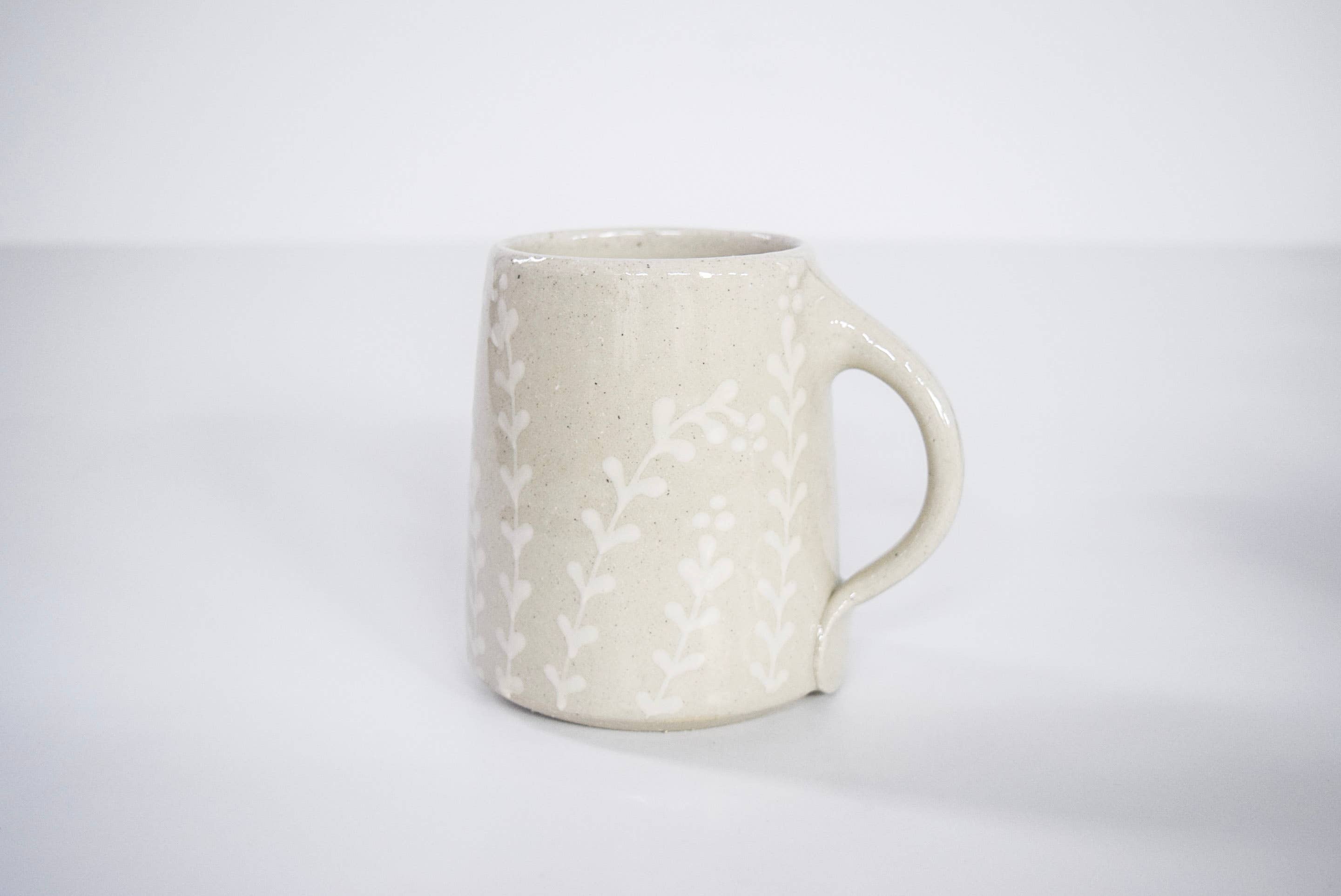 Curry Wilkinson Pottery - Wholesale Coffee Mug - Handmade Decorated Stoneware Mug with White Florals1