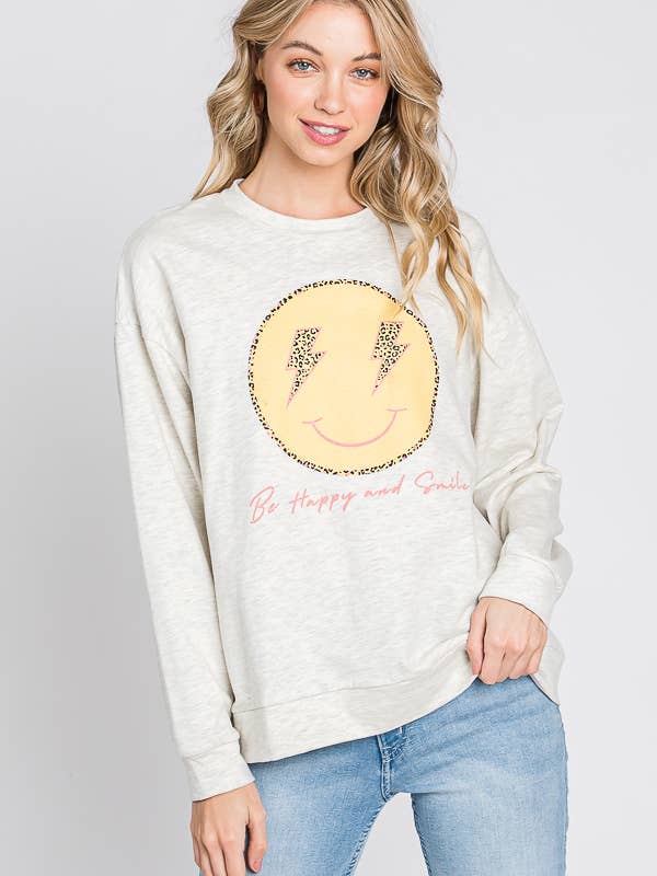 FARINA D'AVENA maglione con grafica «be happy and smile» con faccina felice in vendita all'ingrosso su Faire1