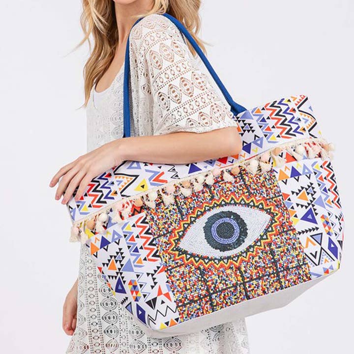 MT EVIL EYE BOHO PRINT POM POM FRINGE TOTE BAG for wholesale on Faire1